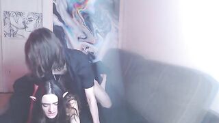 The girl slowly moves her hips on a hard cock, moaning loudly