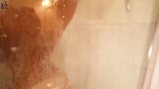 A young beautiful woman plays with a big dildo in the shower