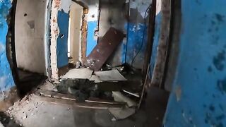 Girl shows her big boobs while walking around a horrible house