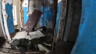 Girl shows her big boobs while walking around a horrible house