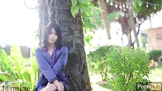 A solo masturbation session with an Asian girl in the garden, using a vibrator and dildo to reach orgasm