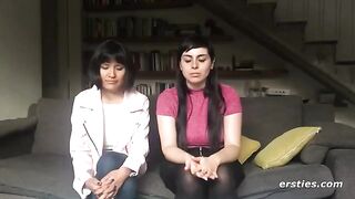 Two girls are having fun with a strapon dildo