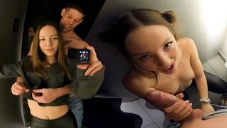 A girl is having fun with a guy in the dressing room of the mall
