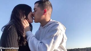 A passionate couple has sex in the park without any barriers