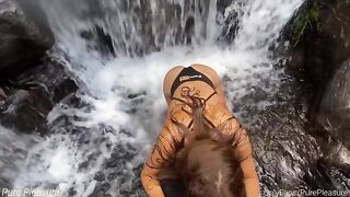Passionate sex of amateur couple near the waterfall on a risky spot