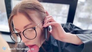 A woman talks on the phone with her husband while being fucked by her friend
