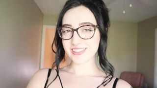 A hot brunette girl is reading a funny hysterical literature