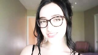 A hot brunette girl is reading a funny hysterical literature