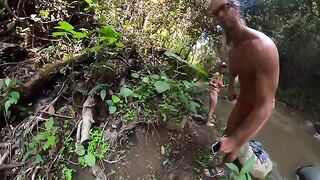 A hot couple is fucking in the river surrounded by jungle trees