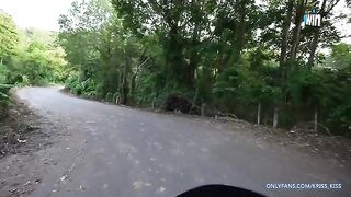 A girl has her first motorcycle ride with a stranger in the jungle