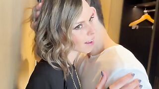 A wife is having fun with two guys at a party