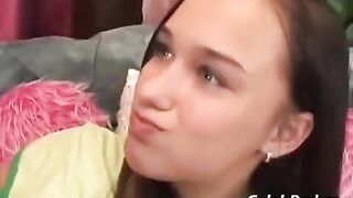 A young cute girl has sex with a man on the couch