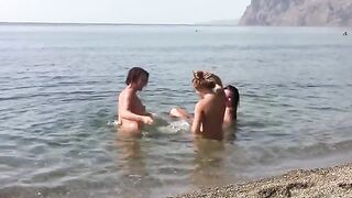 Three naked girls on the beach with erporn action
