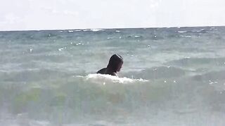 Two hot girls are basking in the sun naked on the beach