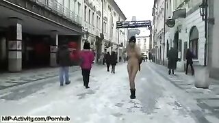 A student bares her boobs and ass on the city streets in this provocative video