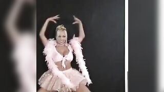A charming Russian is dancing and showing her slim body