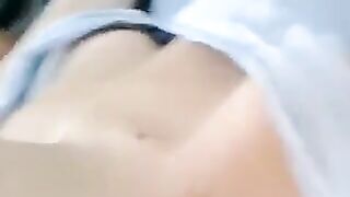 A half-naked girl tells a lie and caresses her body with her hands in the video