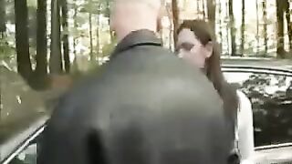 A girl was caught with a guy and she began to tear her clothes on the hood of the car