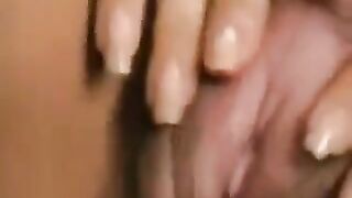 Girl caresses her big clit and hairy pussy, showcasing her unique charm