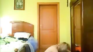 A man peeps at his home naked with a camera