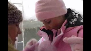 Two girls keep themselves warm on a cold winter day