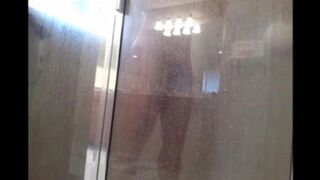 A man washes himself under a hidden camera