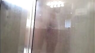 A man washes himself under a hidden camera