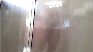 A man washes himself under a hidden camera