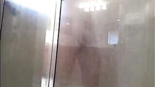 A man washes himself under a hidden camera