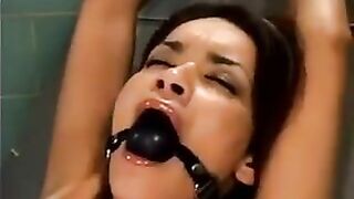 A bald guy was fucking a girl with the help of a sex machine