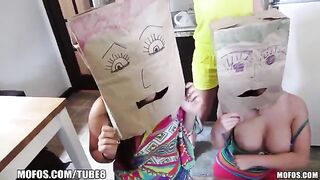The girls wear bags on their heads and have sex