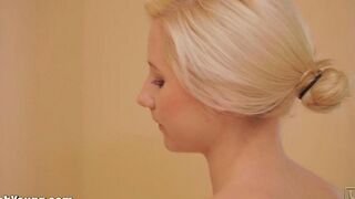 A cute girl plays with a brush in a naughty way