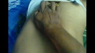 The husband makes a massage for her nipples herself