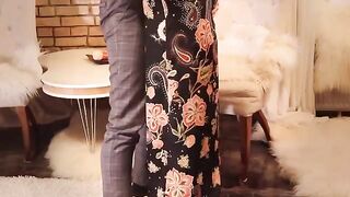 Passionate sex in the long black dress and high heels, a fiery redhead