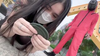 A hot Chinese girl is participating in a sexy version of the squid game