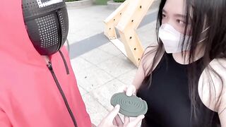 A hot Chinese girl is participating in a sexy version of the squid game