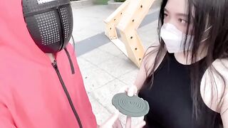 A hot Chinese girl is participating in a sexy version of the squid game
