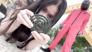 A hot Chinese girl is participating in a sexy version of the squid game
