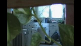 A married couple has fun while walking naked in their house