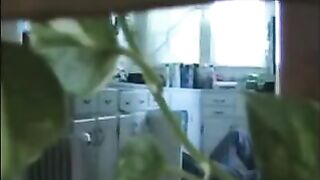 A married couple has fun while walking naked in their house