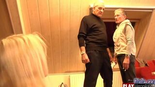 A bearded man with gray hair penetrates a young member