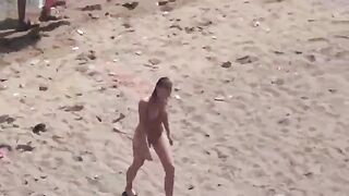 A pair of naked people are having fun at sea