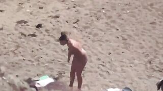 A pair of naked people are having fun at sea