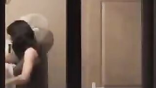 The guy looks at himself in the mirror completely naked