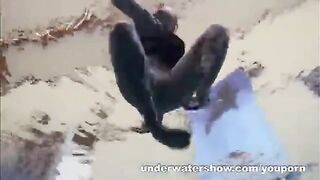 A hot naked chick is having fun in the swimming pool