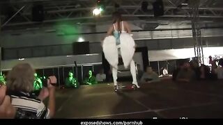 A hot brunette learns to work with a stripper pole and remove clothes