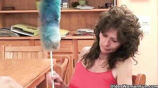 A mature woman plays with her pussy with her fingers