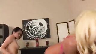 Two lesbian beauties rub their pussies through the skirts