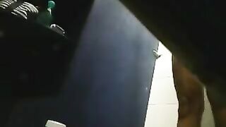 There is a camera in the shower and it films a girl's shaved pussy