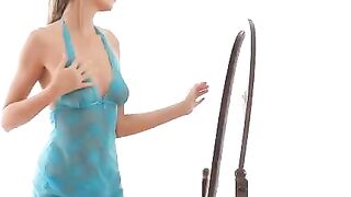 The erotic dance of a young model in front of the mirror
